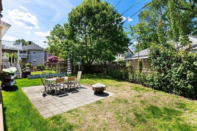2218 Mystic Valley Pkwy, Medford, MA 02155 - view of yard featuring a patio and a fire pit