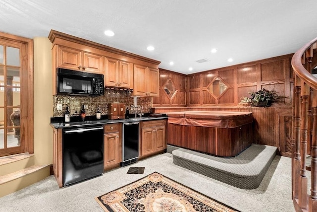 196 Plymouth Ave, Quincy, MA 02169 - indoor wet bar with black appliances, decorative backsplash, recessed lighting, and light colored carpet