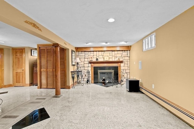 196 Plymouth Ave, Quincy, MA 02169 - unfurnished living room with baseboard heating, a stone fireplace, and baseboards