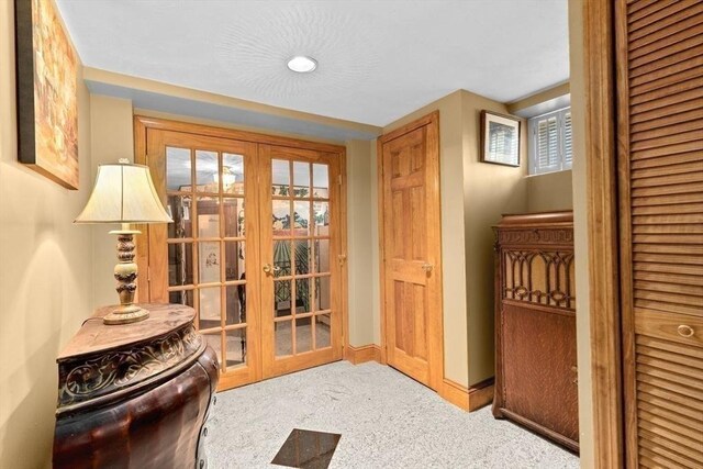 196 Plymouth Ave, Quincy, MA 02169 - doorway to outside with french doors, carpet flooring, and baseboards