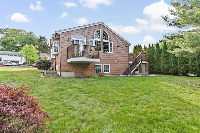 196 Plymouth Ave, Quincy, MA 02169 - back of property featuring stairway, a yard, and a wooden deck