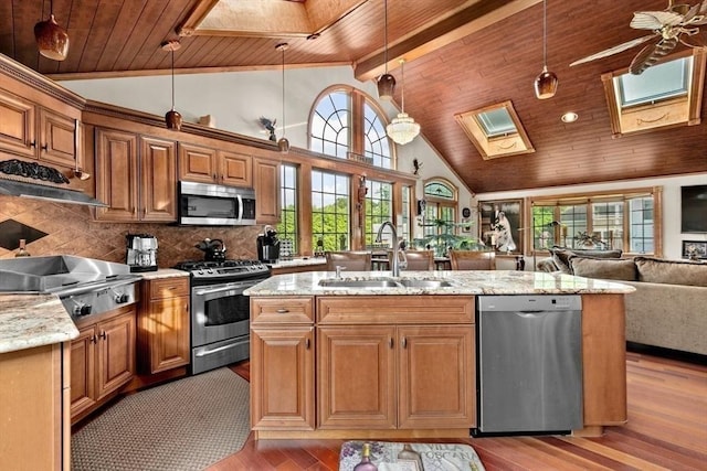 196 Plymouth Ave, Quincy, MA 02169 - kitchen featuring appliances with stainless steel finishes, a sink, a skylight, wooden ceiling, and healthy amount of natural light