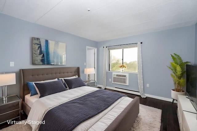 bedroom featuring wood finished floors, baseboards, baseboard heating, and a wall mounted AC