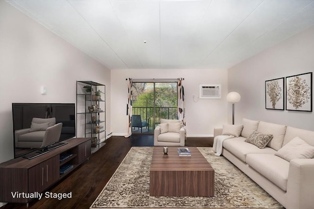 living area featuring a wall mounted air conditioner, baseboards, and dark wood finished floors