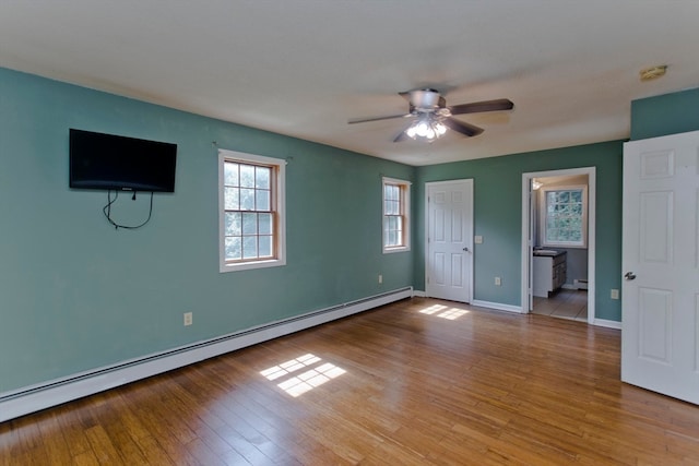 unfurnished room featuring light hardwood / wood-style flooring, a baseboard heating unit, and ceiling fan