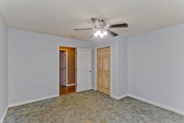 unfurnished bedroom featuring carpet flooring, ceiling fan, and a closet