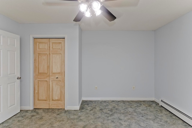 unfurnished bedroom featuring a baseboard radiator, a closet, ceiling fan, and carpet flooring