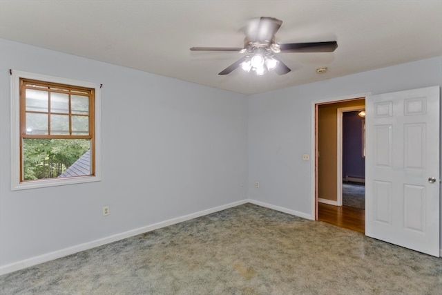 unfurnished room featuring carpet and ceiling fan