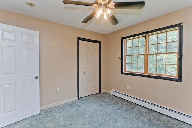 unfurnished bedroom featuring ceiling fan, light colored carpet, and a baseboard heating unit