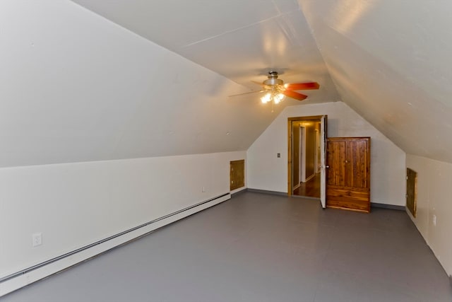 additional living space featuring ceiling fan, lofted ceiling, and a baseboard heating unit