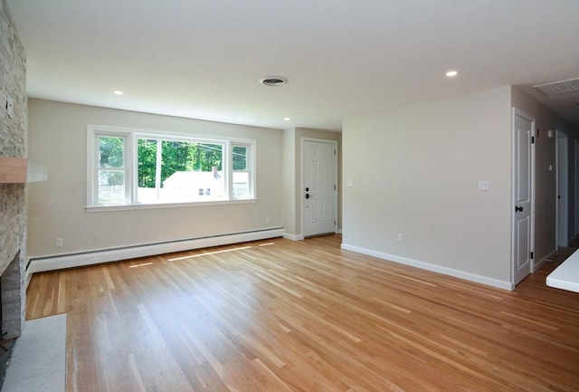 19 Woodcliff Rd, Holbrook, MA 02343 - unfurnished living room featuring a baseboard heating unit, a fireplace, light wood-type flooring, baseboards, and recessed lighting