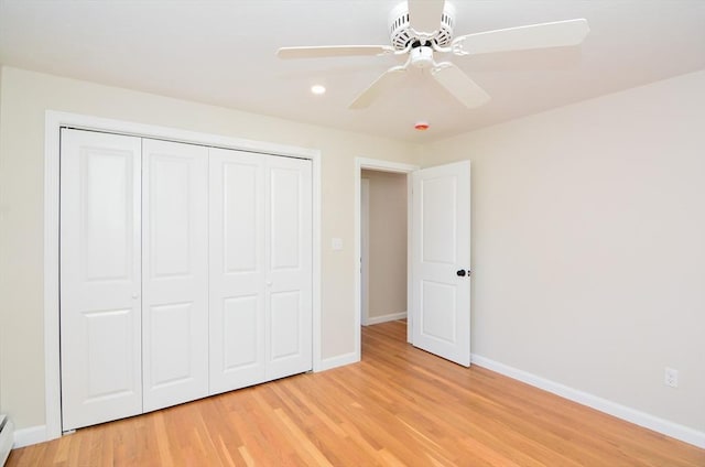 19 Woodcliff Rd, Holbrook, MA 02343 - unfurnished bedroom with baseboards, light wood-style floors, a closet, recessed lighting, and baseboard heating
