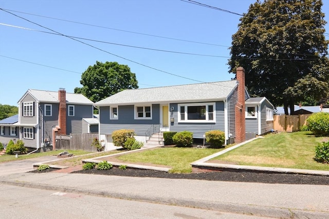 19 Woodcliff Rd, Holbrook, MA 02343 - view of front of house featuring a chimney