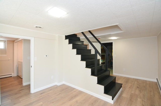19 Woodcliff Rd, Holbrook, MA 02343 - stairway with wood finished floors, baseboard heating, and baseboards
