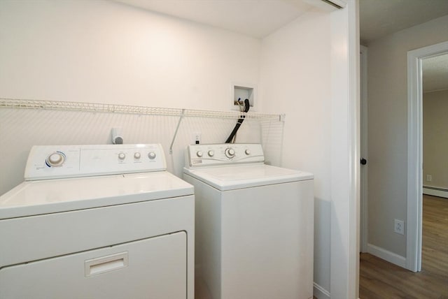 19 Woodcliff Rd, Holbrook, MA 02343 - washroom featuring washing machine and dryer, wood finished floors, baseboard heating, and baseboards