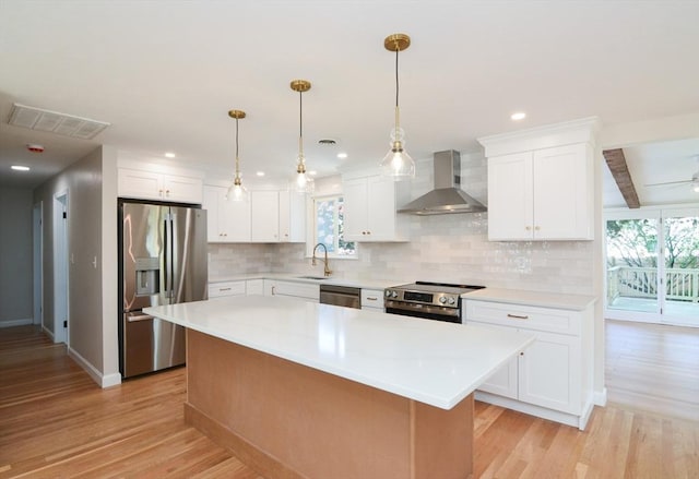 19 Woodcliff Rd, Holbrook, MA 02343 - kitchen featuring appliances with stainless steel finishes, wall chimney exhaust hood, healthy amount of natural light, a sink, and beam ceiling