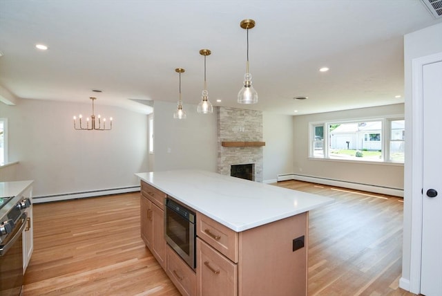 19 Woodcliff Rd, Holbrook, MA 02343 - kitchen featuring a baseboard heating unit, stainless steel appliances, light wood-type flooring, and recessed lighting