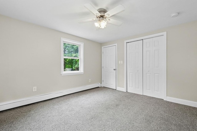 31 Granite St, Walpole, MA 02081 - unfurnished bedroom with baseboard heating, carpet, ceiling fan, and a closet
