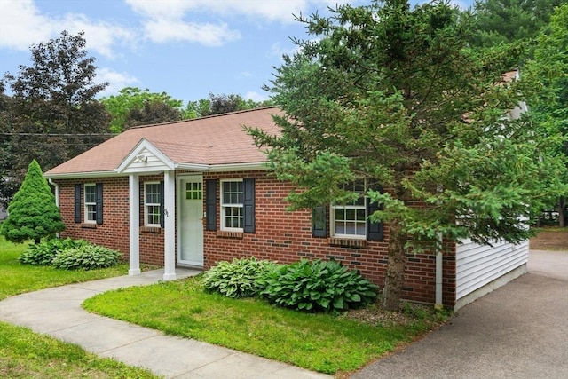 31 Granite St, Walpole, MA 02081 - view of front of property featuring brick siding and a shingled roof