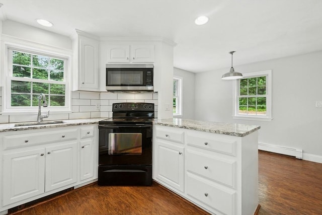 31 Granite St, Walpole, MA 02081 - kitchen with stainless steel microwave, black / electric stove, a baseboard heating unit, light stone countertops, and dark wood-type flooring
