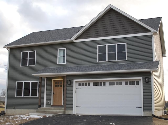 front of property featuring a garage