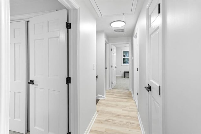 hallway with light wood-type flooring