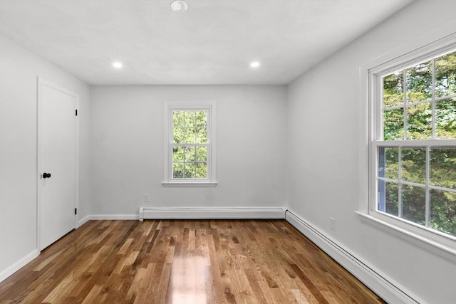 6 Walter St, Norton, MA 02766 - unfurnished room featuring a baseboard heating unit, plenty of natural light, wood finished floors, and recessed lighting