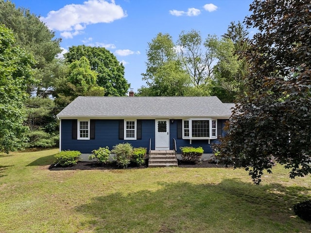 6 Walter St, Norton, MA 02766 - view of front facade with a front yard, a shingled roof, and a chimney
