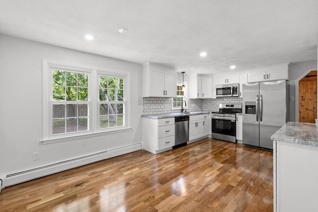 6 Walter St, Norton, MA 02766 - kitchen featuring stainless steel appliances, a baseboard radiator, healthy amount of natural light, white cabinetry, and recessed lighting