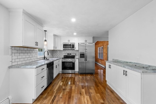 6 Walter St, Norton, MA 02766 - kitchen featuring stainless steel appliances, a baseboard radiator, dark wood-style flooring, tasteful backsplash, and recessed lighting