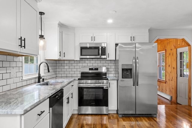 6 Walter St, Norton, MA 02766 - kitchen with appliances with stainless steel finishes, a baseboard radiator, a sink, and plenty of natural light