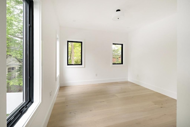 230 Auburn St Unit 230, Newton, MA 02466 - empty room with plenty of natural light, light wood-type flooring, and baseboards