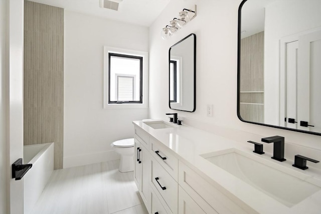230 Auburn St Unit 230, Newton, MA 02466 - full bathroom with double vanity, toilet, and baseboards