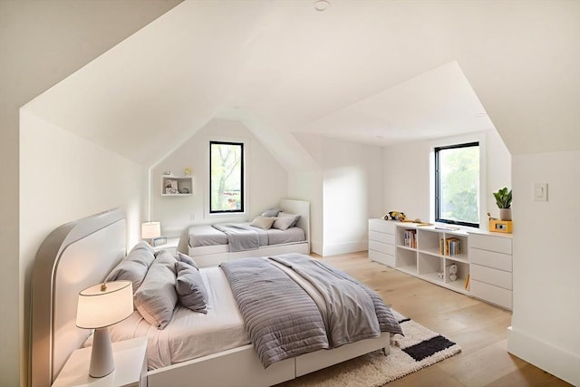 230 Auburn St Unit 230, Newton, MA 02466 - bedroom featuring lofted ceiling, light wood finished floors, and baseboards