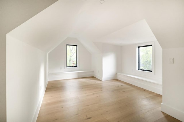 230 Auburn St Unit 230, Newton, MA 02466 - bonus room with light wood finished floors, vaulted ceiling, and baseboards