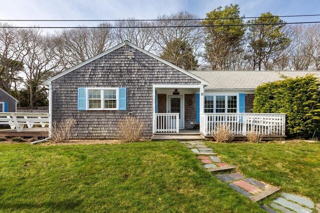 230 Gosnold St Unit 11Abc, Barnstable, MA 02601 - view of front facade featuring a front yard and a deck