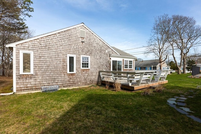230 Gosnold St Unit 11Abc, Barnstable, MA 02601 - rear view of property with a wooden deck and a lawn
