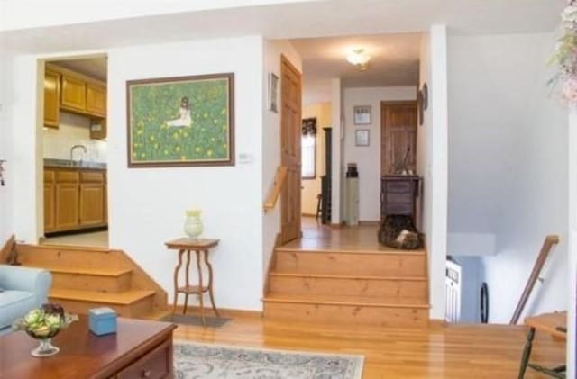 6 Tisdale Dr Unit 6, Dover, MA 02030 - living area featuring light wood-style flooring and stairs