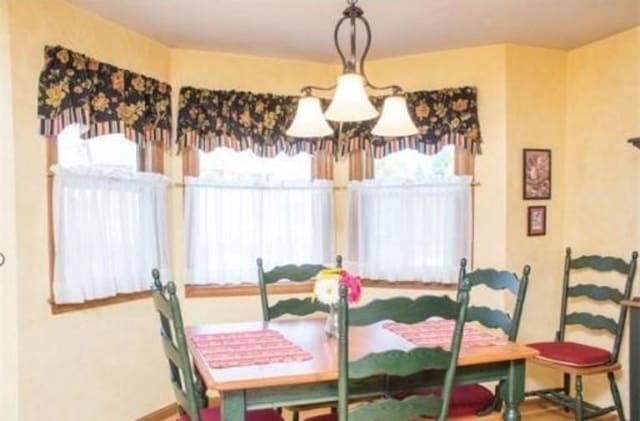 6 Tisdale Dr Unit 6, Dover, MA 02030 - dining room with a chandelier and baseboards