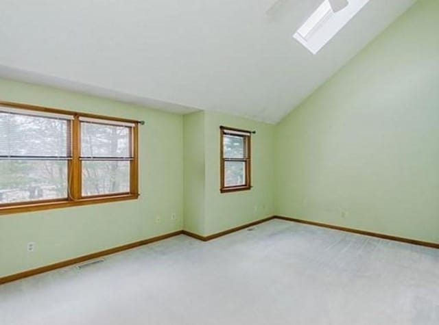6 Tisdale Dr Unit 6, Dover, MA 02030 - carpeted empty room featuring a skylight, plenty of natural light, and lofted ceiling