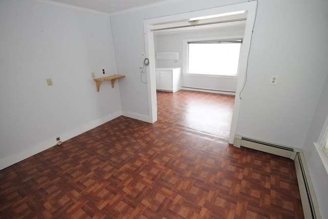 57 Edgewater Rd-, Waterfront, Hull, MA 02045 - spare room featuring ornamental molding, baseboard heating, and baseboards