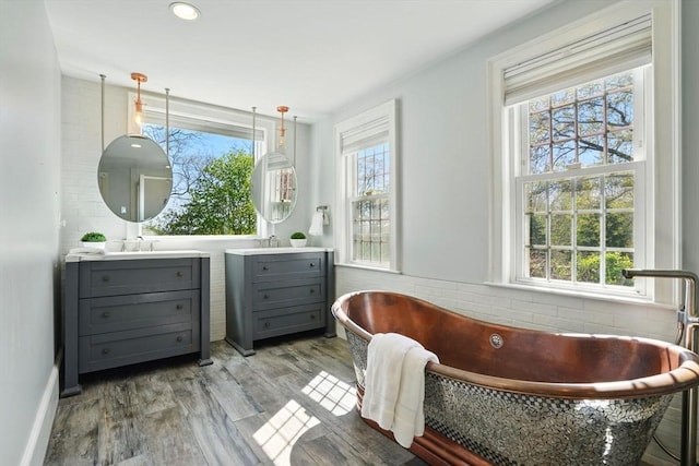 interior space featuring baseboards and wood finished floors