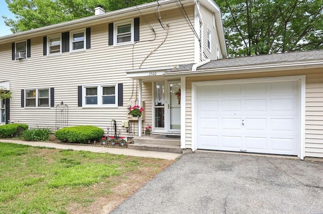 2500 Pendleton Ave Unit 2500, Chicopee, MA 01022 - view of front of property featuring an attached garage, driveway, and cooling unit