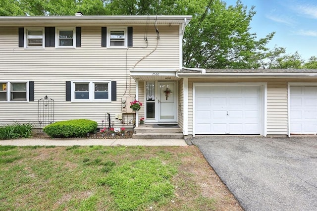2500 Pendleton Ave Unit 2500, Chicopee, MA 01022 - view of front facade with driveway and an attached garage