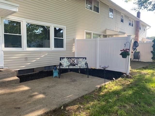 2500 Pendleton Ave Unit 2500, Chicopee, MA 01022 - view of side of home with a patio and a chimney