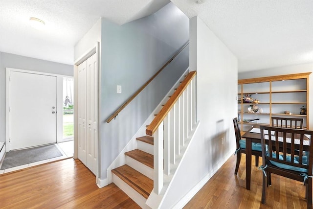 2500 Pendleton Ave Unit 2500, Chicopee, MA 01022 - entryway featuring wood finished floors, stairs, and a textured ceiling