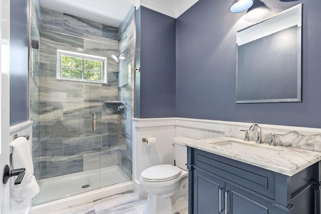 306 Laws Brook Rd, Concord, MA 01742 - bathroom featuring toilet, vanity, a shower stall, ornamental molding, and a wainscoted wall