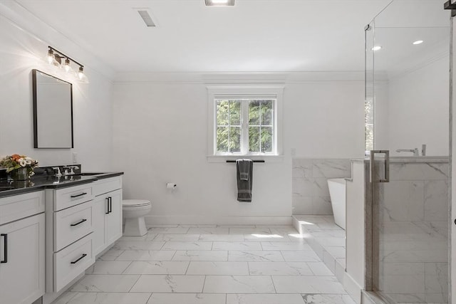 306 Laws Brook Rd, Concord, MA 01742 - full bath featuring marble look tile flooring, vanity, a freestanding bath, a stall shower, and toilet