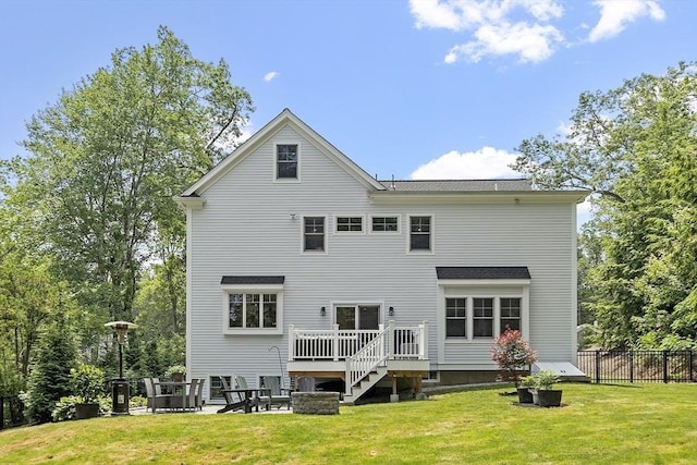 306 Laws Brook Rd, Concord, MA 01742 - back of property with an outdoor fire pit and a wooden deck