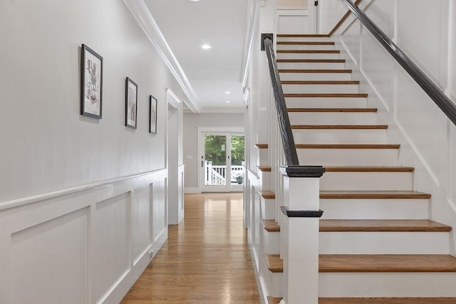 306 Laws Brook Rd, Concord, MA 01742 - stairs featuring crown molding, wood finished floors, and recessed lighting